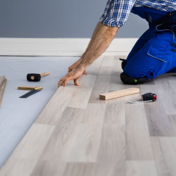 Flooring contractor installing vinyl planks