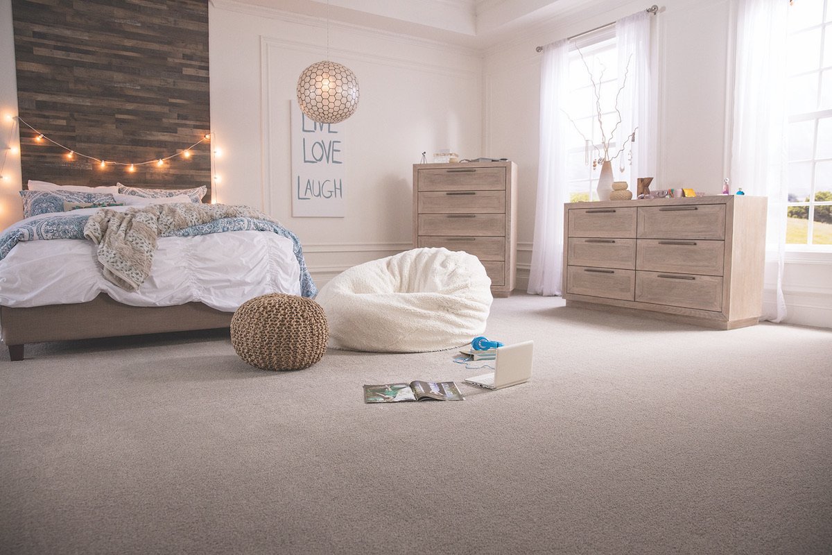 Suburban bedroom with beige carpet
