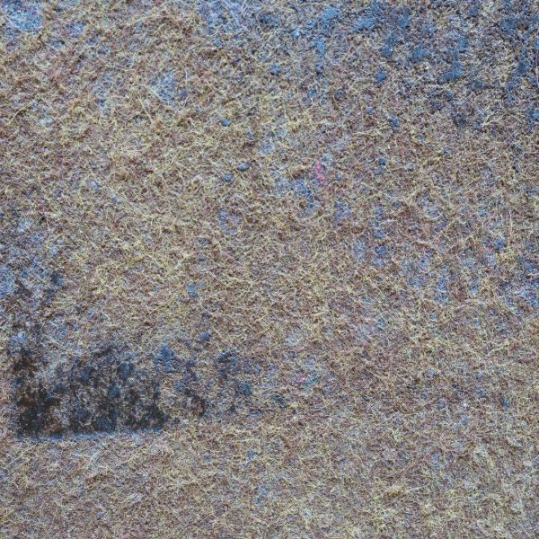 Damaged carpet floor with dirt and discoloration