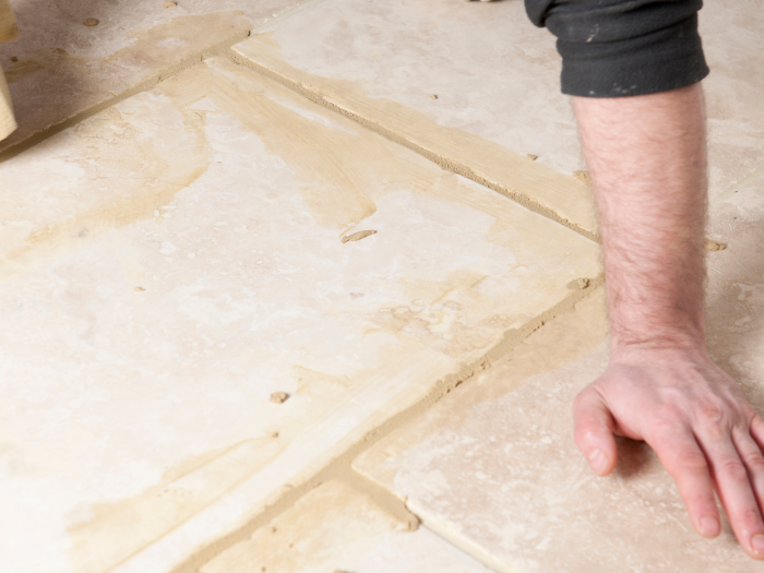 Applying grout to tile flooring