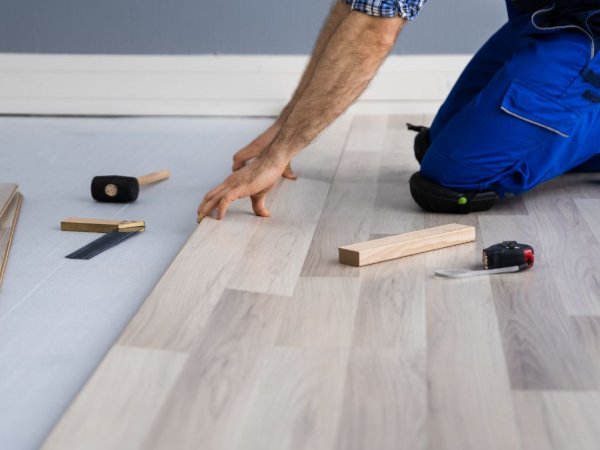 Flooring contractor installing vinyl planks